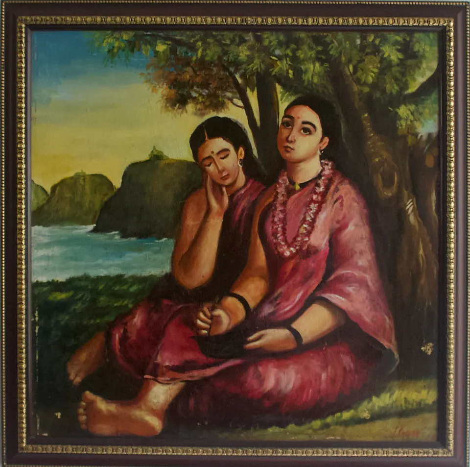 Two women in deep pink clothing rest beneath a tree beside water and distant cliffs.