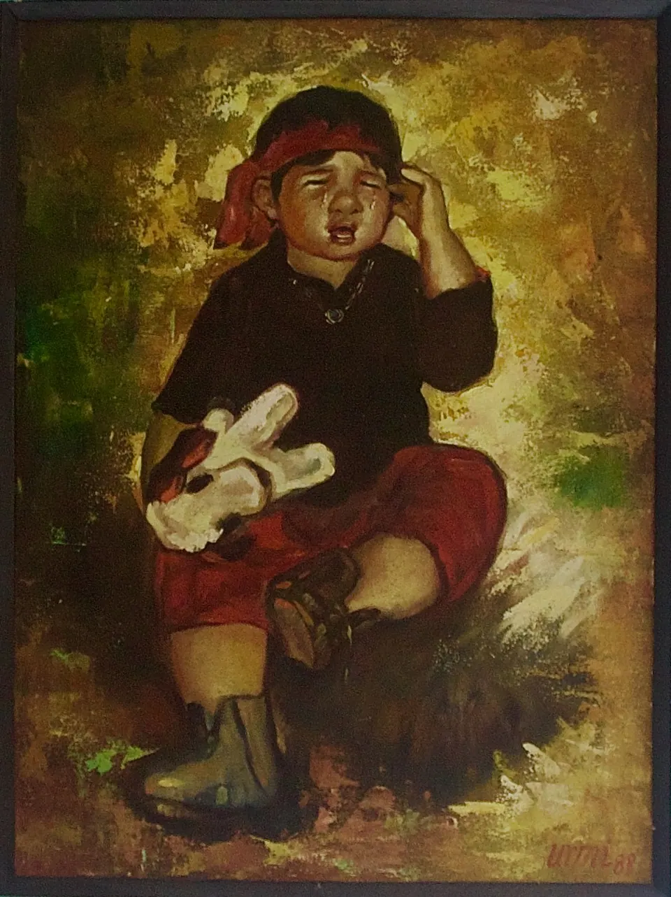 Crying child in dark clothing and red trousers holding a white stuffed rabbit.