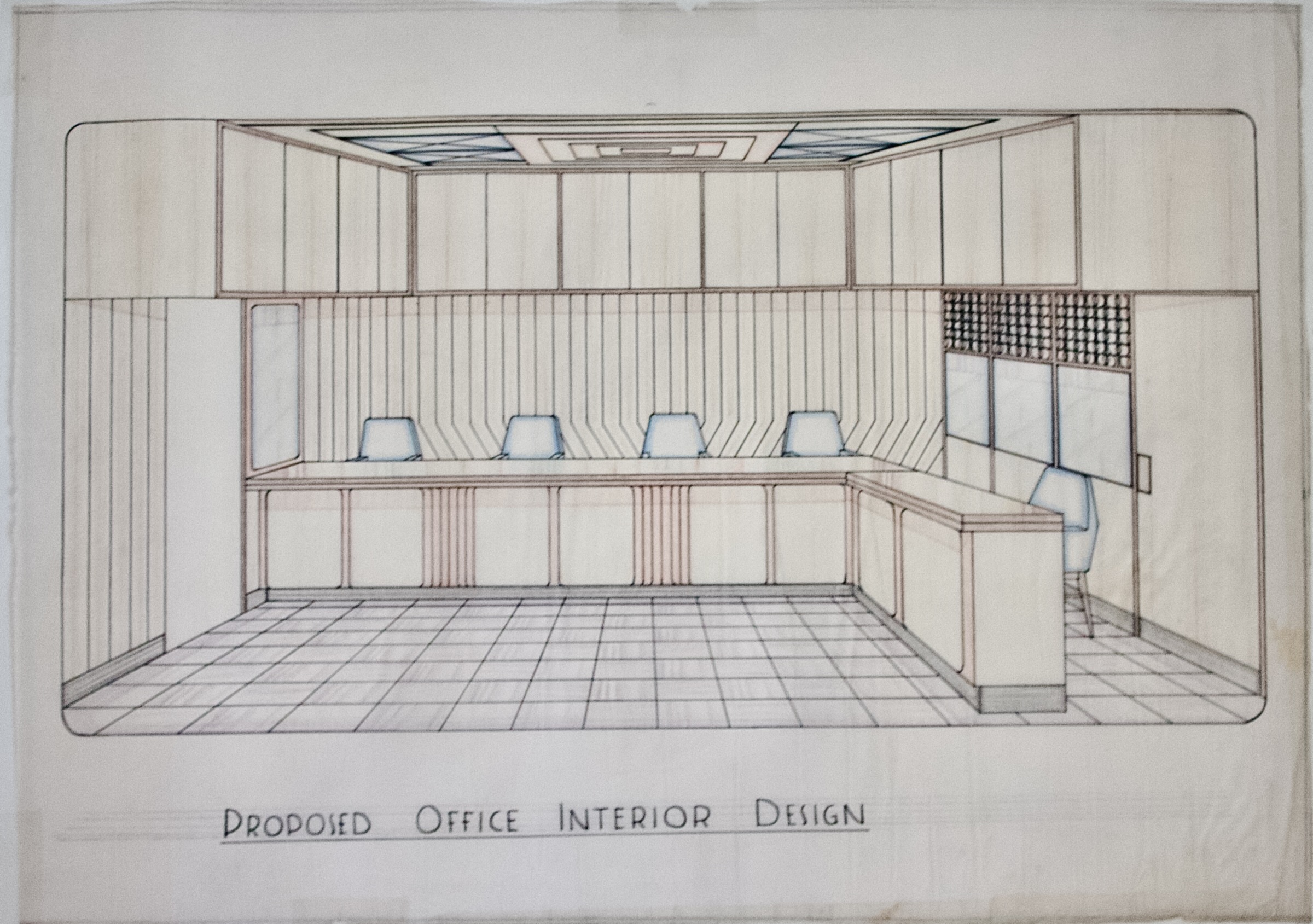 Office perspective with long work counter, blue chairs, overhead cabinets, paneled walls, tiled floor, and geometric ceiling.